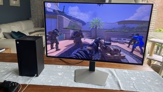 The Samsung S32G80SD sat on a table alongside an Xbox Series X.